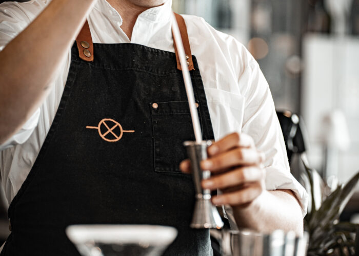 mixologist pouring drink